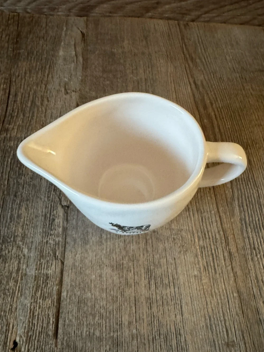 Rae Dunn “Pour.” Ceramic creamer with Cow Graphic